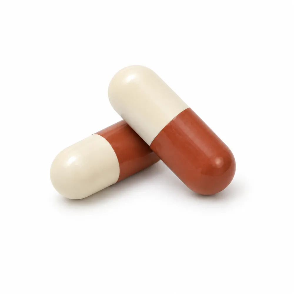Two cream and terracotta capsules