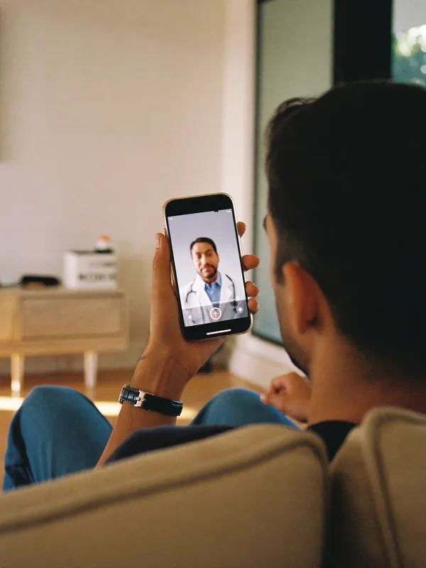 A man on a video call with a doctor